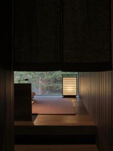 a dark room with a door in the middle at Moke Valley Queenstown in Queenstown