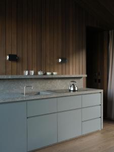 a kitchen with a sink and a counter top at Moke Valley Queenstown in Queenstown