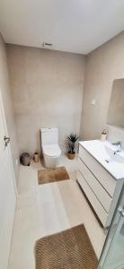 a bathroom with a toilet and a sink at Valença Sky View in Valença