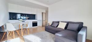 a living room with a couch and a table at Valença Sky View in Valença