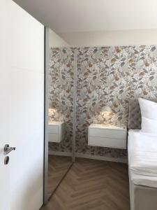 a bedroom with two beds and a wall mural at Fewo Anna in Bernkastel-Kues