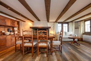a dining room with a table and chairs at Panoramic apartment with charming swiss interior in Wädenswil