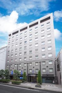 a large building with a large window at Hotel Mystays Premier Hamamatsucho in Tokyo