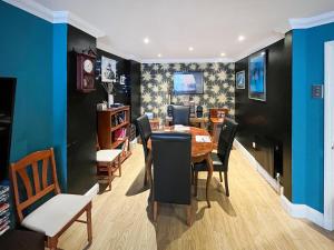 a dining room with a table and chairs at Turner Villa in Ramsgate