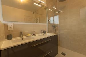 a bathroom with a sink and a mirror at Une Maison en centre ville in Cholet +35 photos