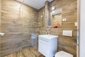 a bathroom with a toilet and a sink at Apinelo Rooms in Split