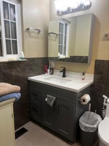a bathroom with a sink and a mirror at STR25-15 Home 3 Bedrooms 2 Bath in Marina +10 photos