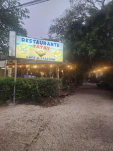 a restaurant with a sign that reads restaurant jam cafe and seafood at tatay cabinas in La Cruz