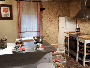 a kitchen with a counter with a bowl on it at Cosy Castle with Pool in Onlay in Onlay