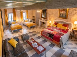a bedroom with a large bed and a living room at Cosy Castle with Pool in Onlay in Onlay