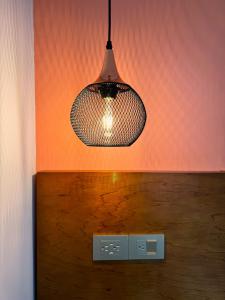 a light hanging from the ceiling of a room at KLEINN HOTEL BOGOTÁ in Bogotá +46 photos