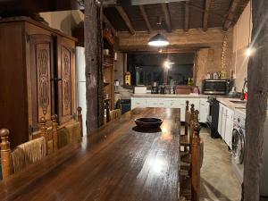a kitchen with a wooden table with a bowl on it at Posada La Escondida in San Carlos