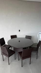 a table and chairs in a room with a table at Casa para lazer e confraternização in Senador Canedo