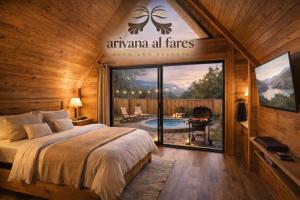 a bedroom with a bed and a sign that reads atarma all fires inn at Arivana Resort in As Sab‘ Ābār ash Sharqīyah