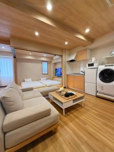 a living room with a couch and a table at Ueno K in Tokyo