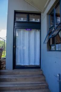 a door with a sign that says sex on it at The Views Apartments in Kariba