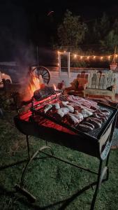 a grill with a bunch of food on it at Rincón del Hum in Mercedes +12 photos