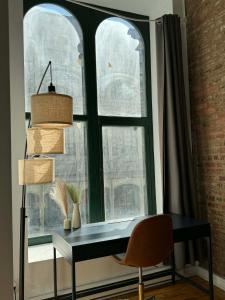 a window with a desk and a chair in front of it at Top Location - The 777 Old Port Gem in Montreal