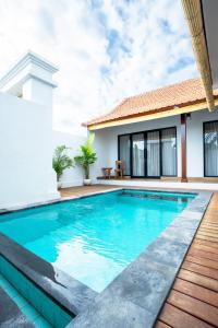 a pool in the backyard of a villa at 2BR Rice Field View Private Villa in Cemagi in Canggu