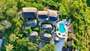an overhead view of a house with a swimming pool at Penida View Village - Infinity pool & Volcano View in Nusa Penida