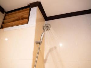a shower with a shower head in a bathroom at Riverside Houayxay Hotel in Ban Houayxay +52 photos