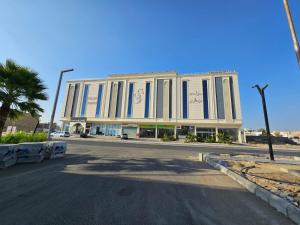 a large building on the side of a street at Golden Bujari Bisha in Qal'at Bishah