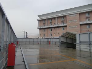 an empty parking lot in front of a building at GOLF Kofu Showa(Adult Only) in Kofu