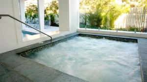 a jacuzzi tub in a house at Stylish Beachside Retreat in Gold Coast