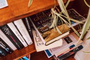 a book shelf with books on it at Tillrander - Scamander Retreat in Scamander