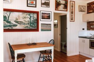 a kitchen with a table and two chairs at Tillrander - Scamander Retreat in Scamander