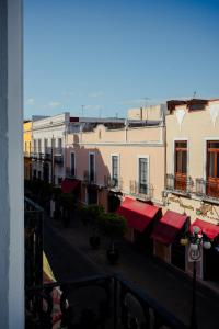 a view of a city street with buildings at Casa Serdán in Puebla