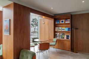 a room with a table and chairs and a window at Cabinet 캐비넷 양양 in Yangyang