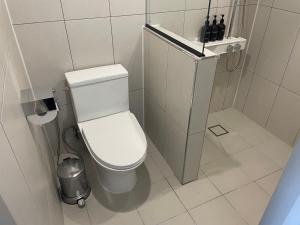 a small bathroom with a toilet and a sink at Cabinet 캐비넷 양양 in Yangyang +23 photos