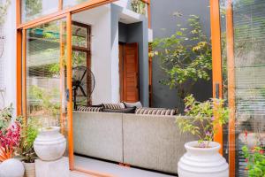 a porch with a bench and plants at Gampaha Heritage in Gampaha