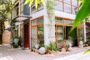 a building with plants in front of it at Gampaha Heritage in Gampaha