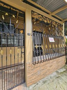 a wrought iron gate on a building at Raed Homestay by ASH in Biñan