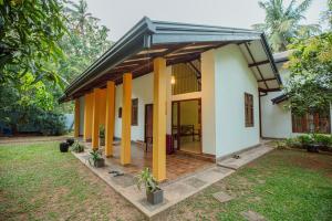 a small house with a pitched roof at Airport Serenity Villa - Near Colombo Airport in Katunayaka +13 photos