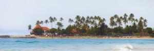 a view of a beach with palm trees and a resort at The wave Dickwella in Dickwella