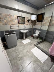 a bathroom with a sink and a toilet at Villas with direct sea views and apartments with partial sea views in Miami, Alexandria, Al Safwa Tower, in Alexandria +209 photos