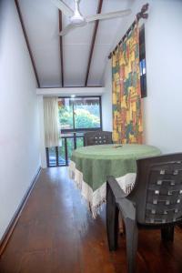 a dining room with a green table and a window at Wagon Wheel Inn in Busse +28 photos