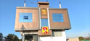 a building with signs on the side of it at Ram Priya hotel in Basāri