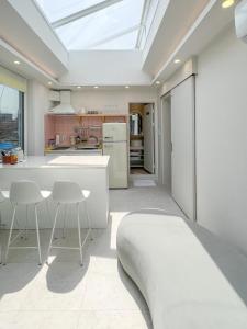 a kitchen with a skylight in the ceiling at Mr. Slow in Sokcho