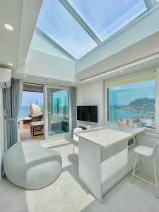 a living room with a view of the ocean at Mr. Slow in Sokcho