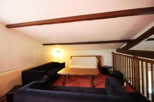 a living room with a couch and a table at La vauloube in Châteauponsac