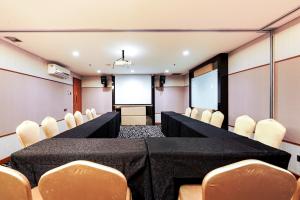 a conference room with a long table and chairs at Sunerra Express Grand Viveana Bandung in Bandung
