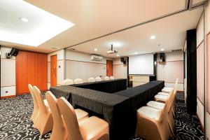 a conference room with chairs and a podium at Sunerra Express Grand Viveana Bandung in Bandung