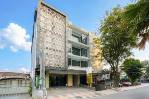 a building on the corner of a street at Sunerra Express Grand Viveana Bandung in Bandung