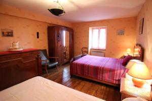 a hotel room with two beds and a window at Négrignas in Augne