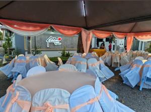 a bunch of chairs are lined up in a tent at Permas Jaya Corner Homestay -Event -Party -TablePool -Karaoke -BBQ in Johor Bahru