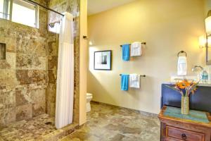a bathroom with a shower and a toilet at Mahana House Country Inn in North Hilo